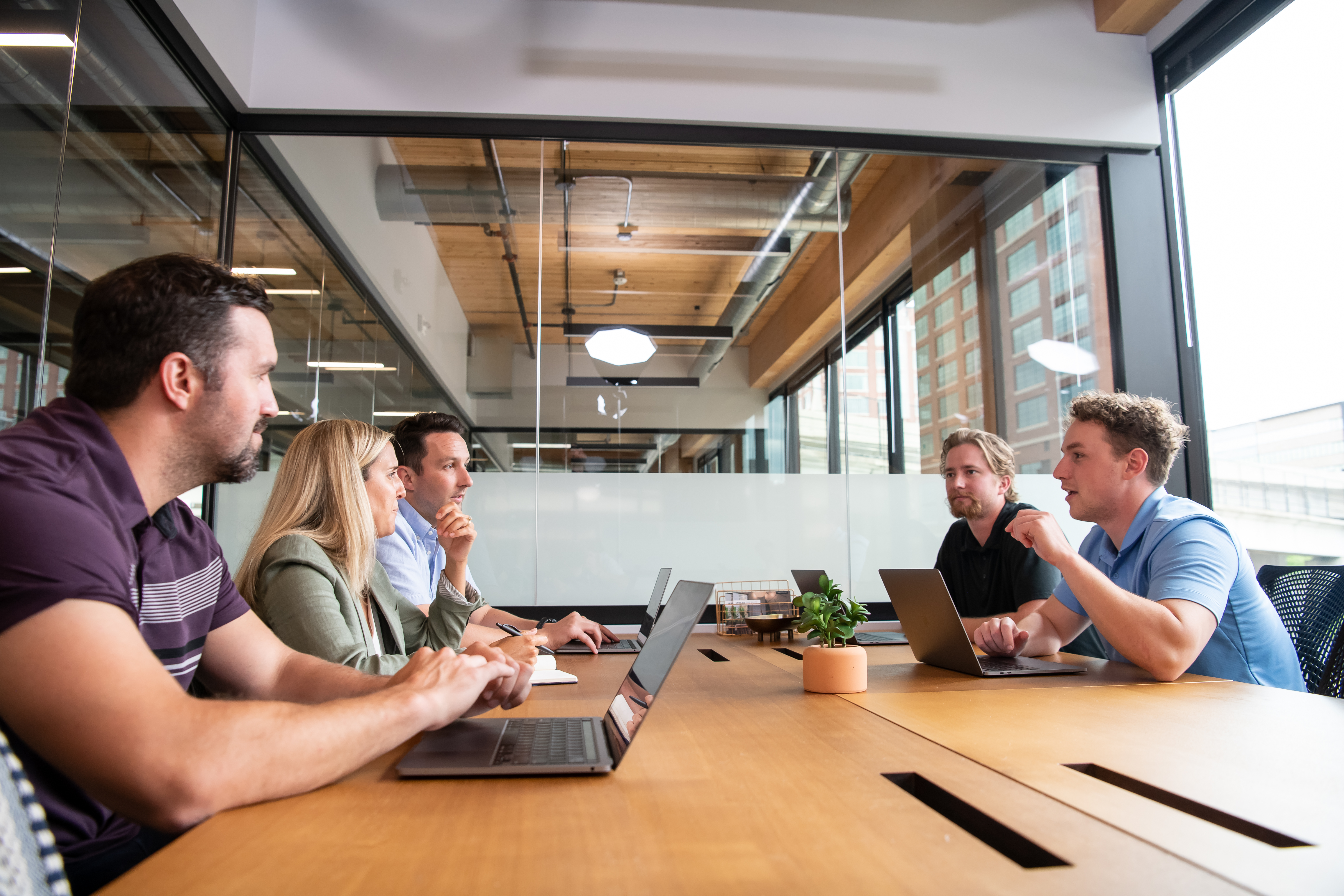 Center Senior Vice President of Sales Frank Roeder and his team meet in a conference room