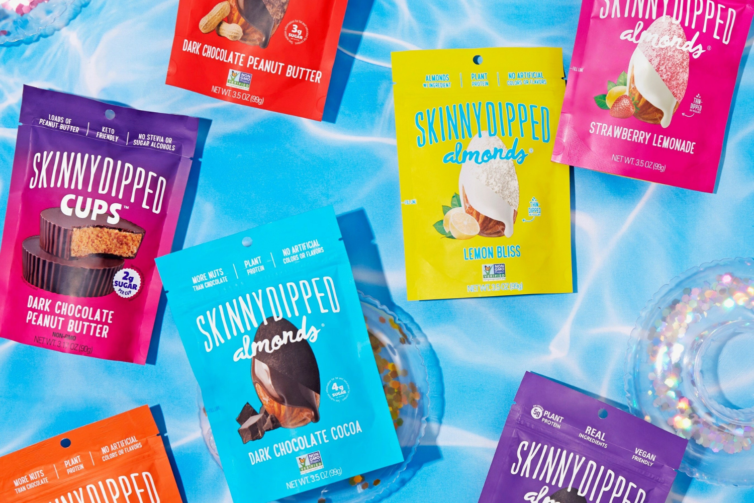 Product imagery of SkinnyDipped-brand snacks.